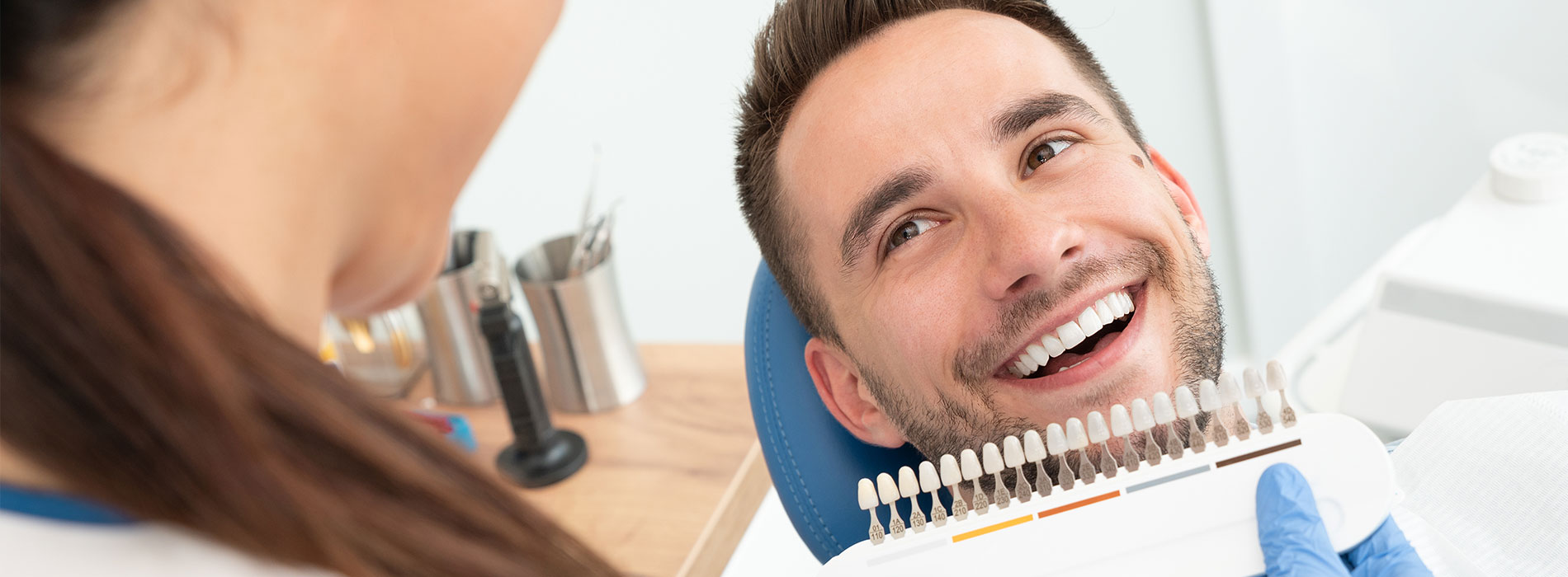 The image shows a hand holding a tablet with a star rating graphic on the screen, indicating high customer satisfaction or approval.